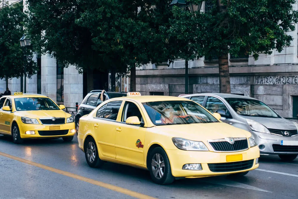 2 yellow taxi cabs