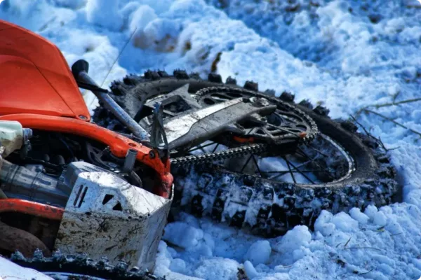 part of motorcycle on snow