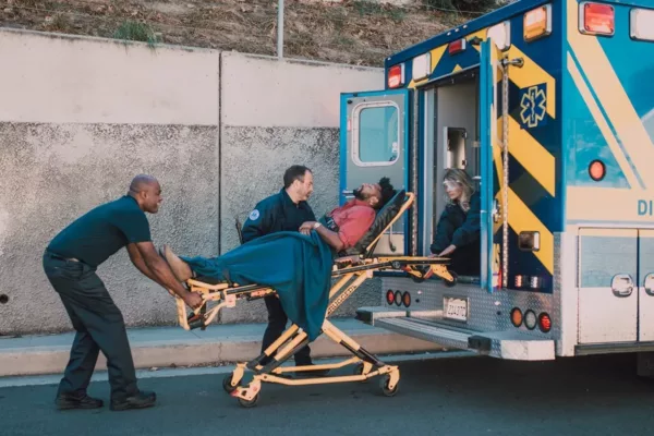 person being loaded in ambulance via stretcher, due to a slip and fall injury